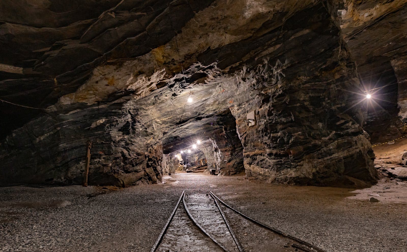 Illuminated underground coal mine tunnel with haulage track