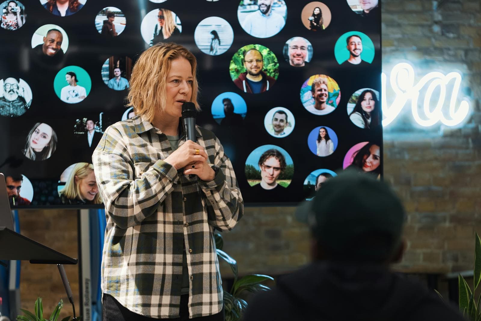 Conference speaker addressing an audience during a technical forum