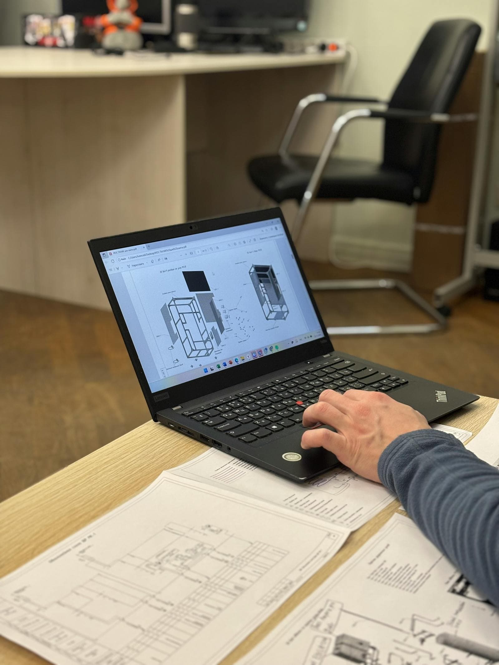 Engineer reviewing pultruded profile geometry and design data on a laptop