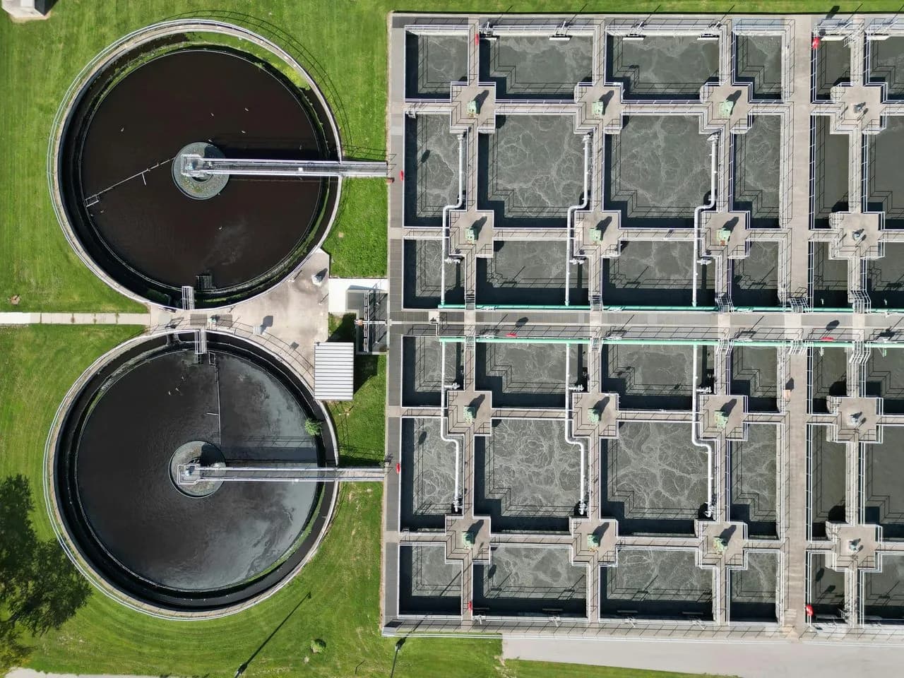 Aerial view of circular clarifiers and rectangular basins at a water treatment plant