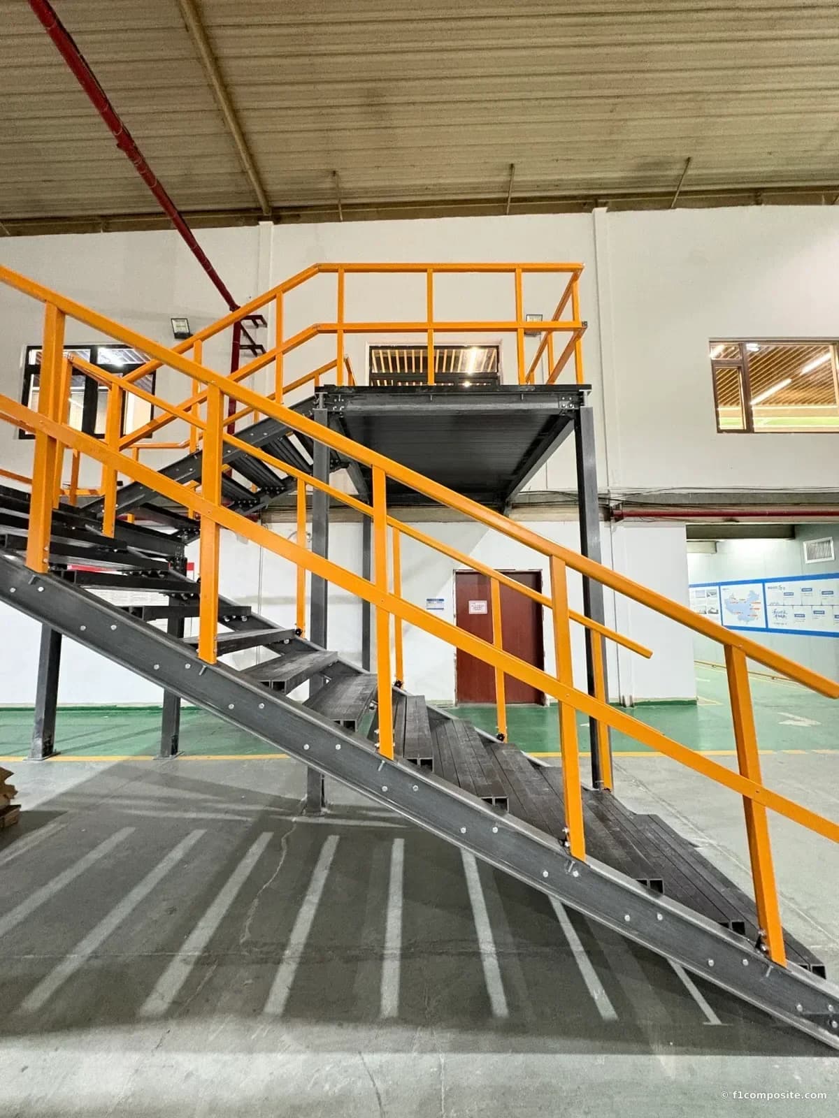FRP I-beam stringers and pultruded profiles forming a staircase frame in F1 Composite's factory