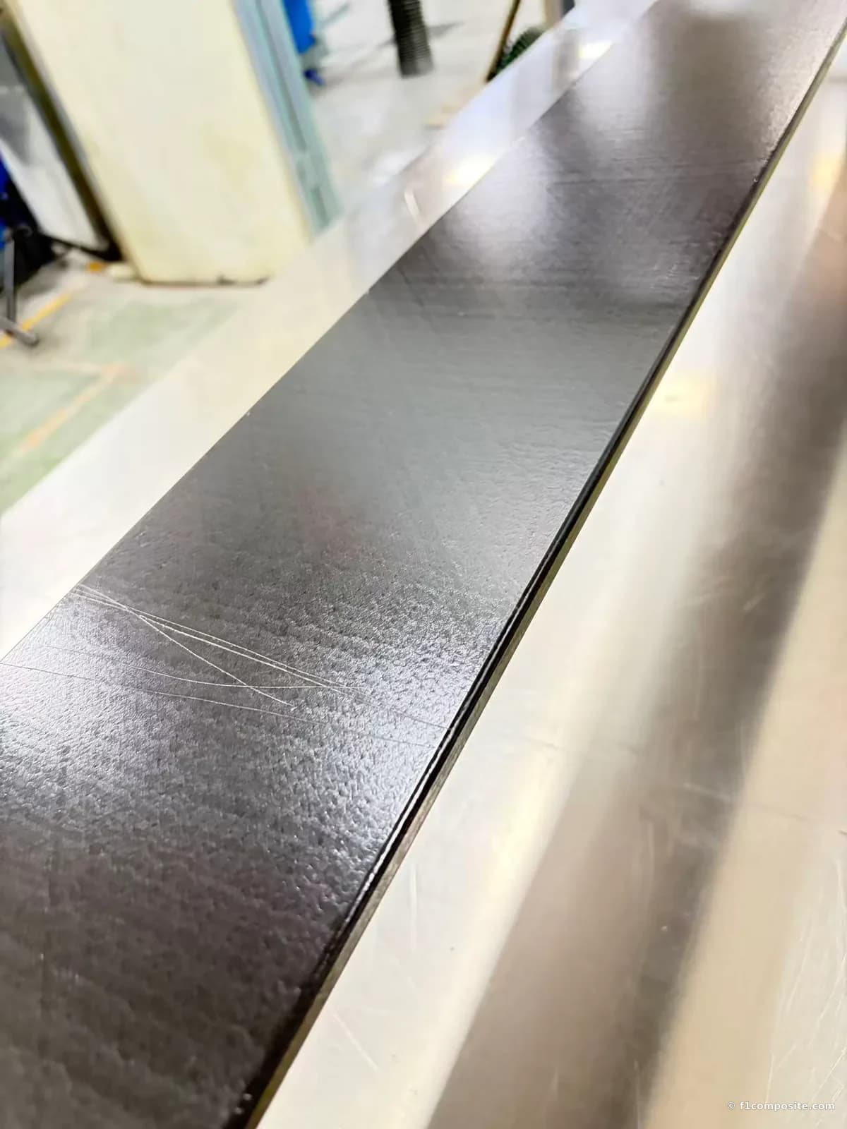 Black pultruded fiberglass sheet with a finished surface on the production line