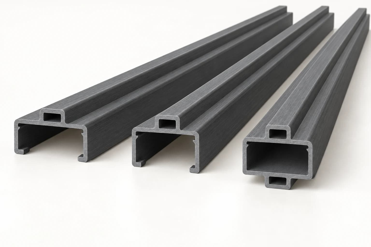 Three fiberglass door frame profiles with continuous hollow raised stops running the full length: two open-back frame sections and one closed mullion concept