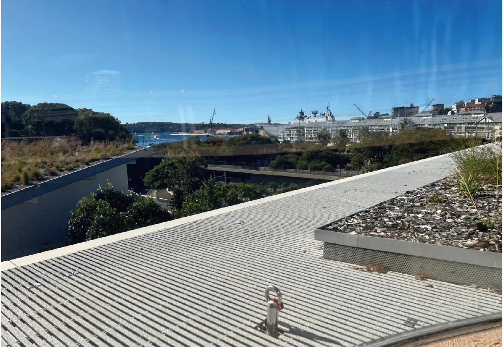 Open pultruded FRP grating installed as a rooftop walkway