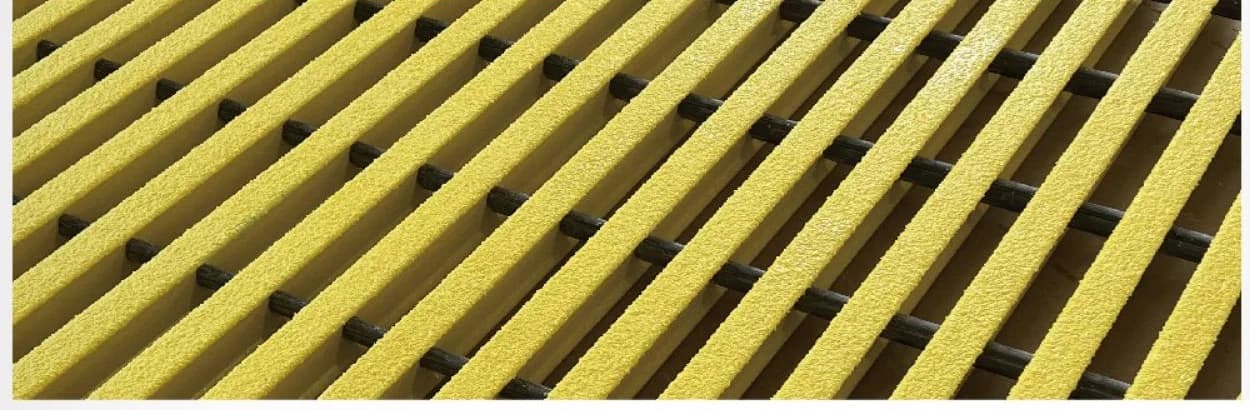Close-up of pultruded FRP grating with T-shaped bearing bars and cross rods